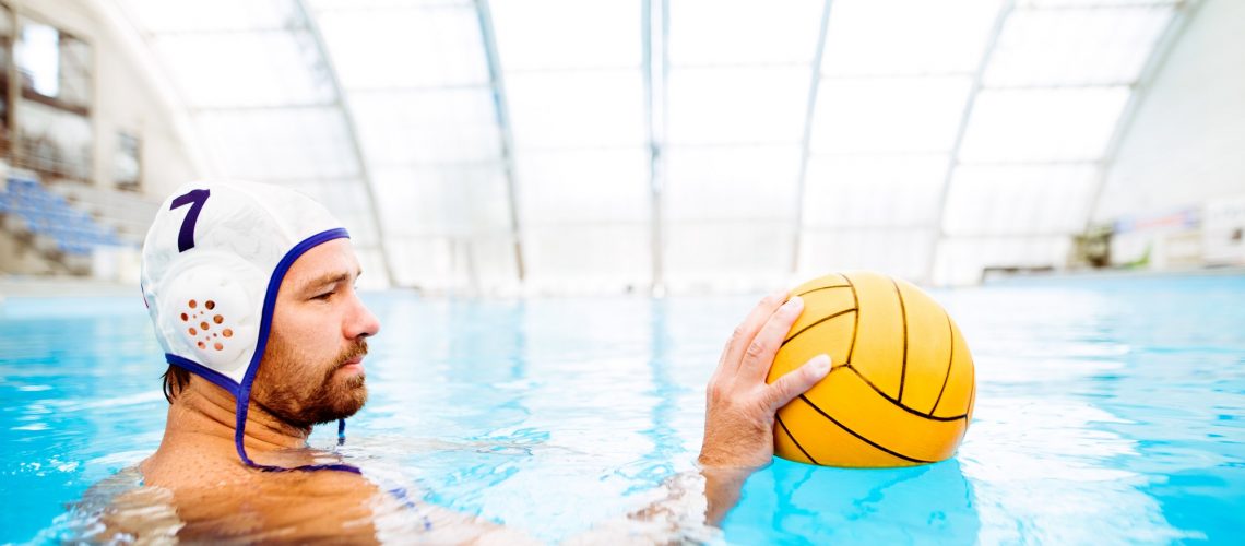 Water polo player in a swimming pool.
